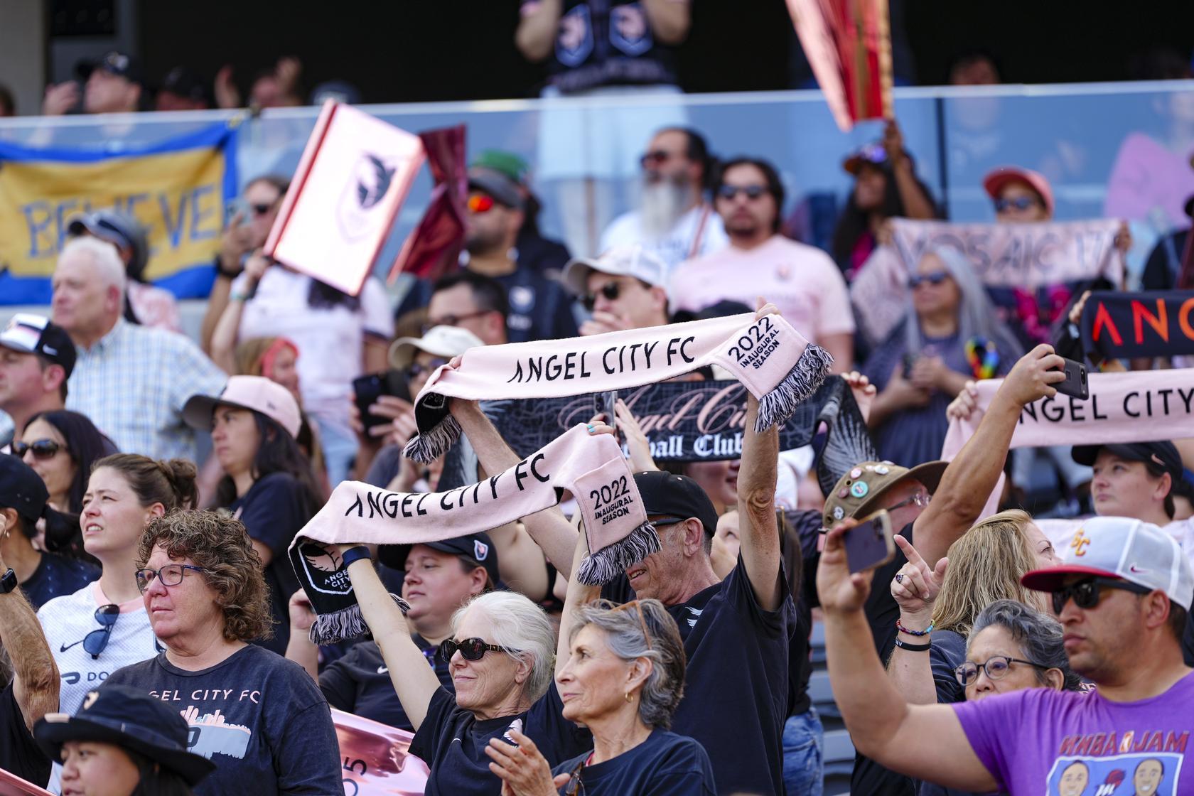 Angel City FC fans celebrating in the stands