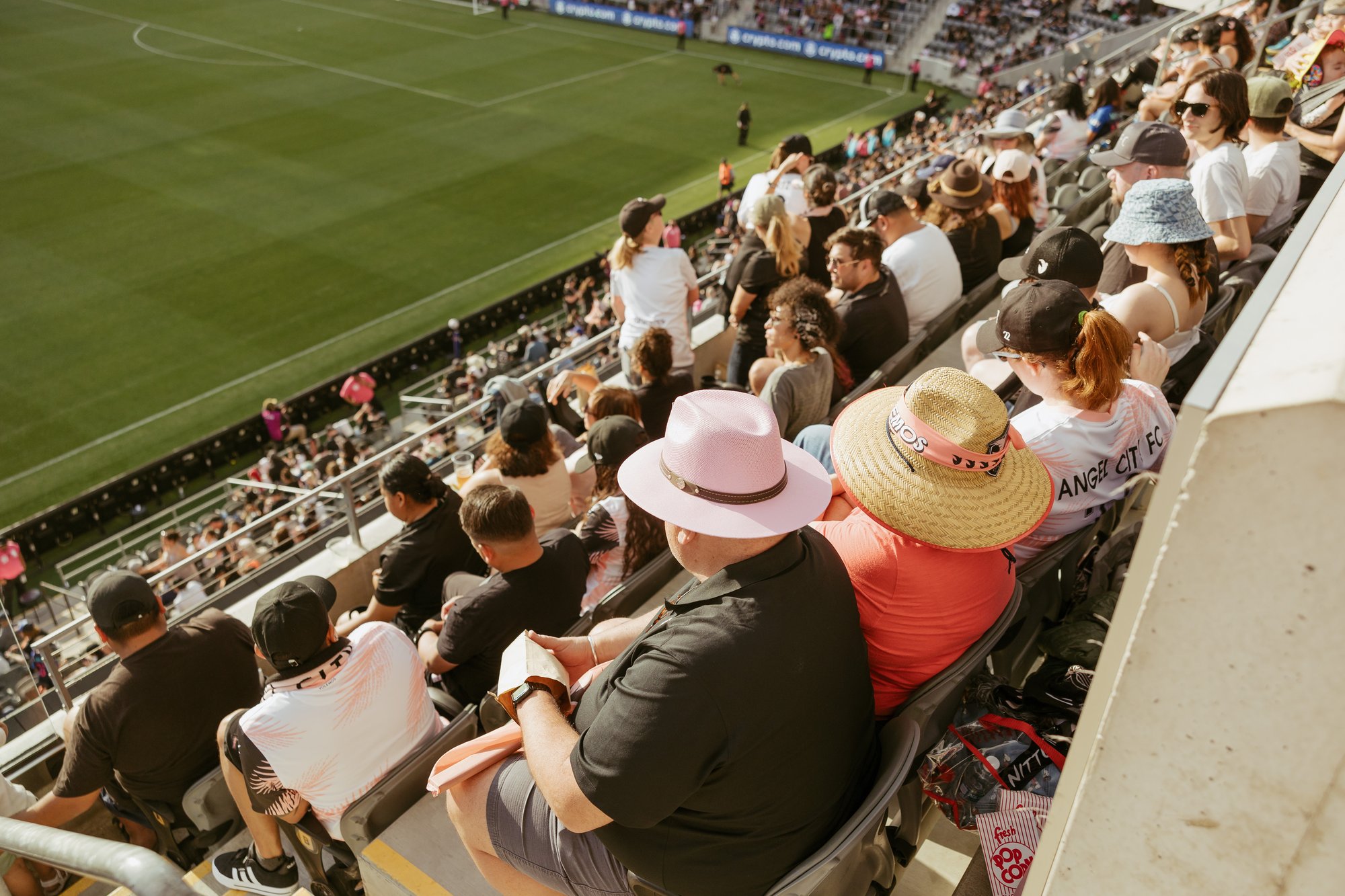 Midfield Box Seats_Premium_Fans sitting